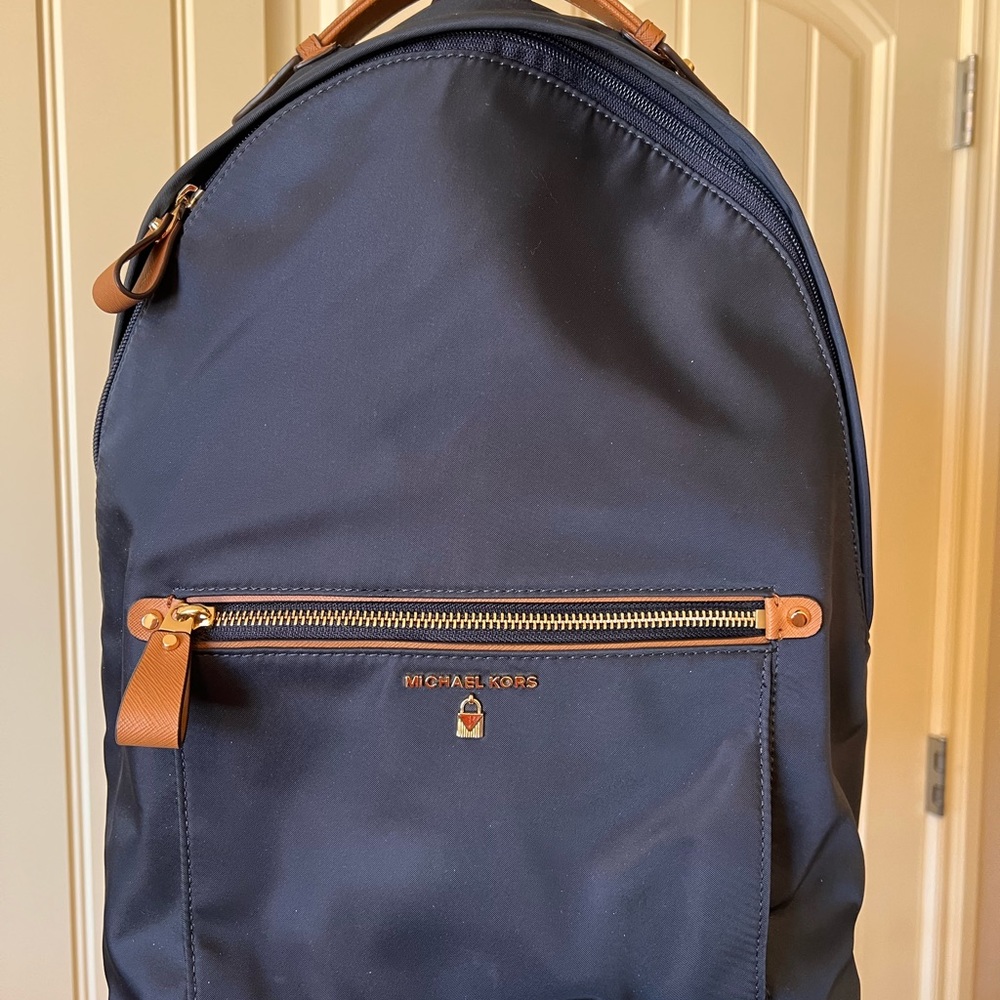 Michael Kors Navy w/tan BACKPACK, NWOT, lots or organization